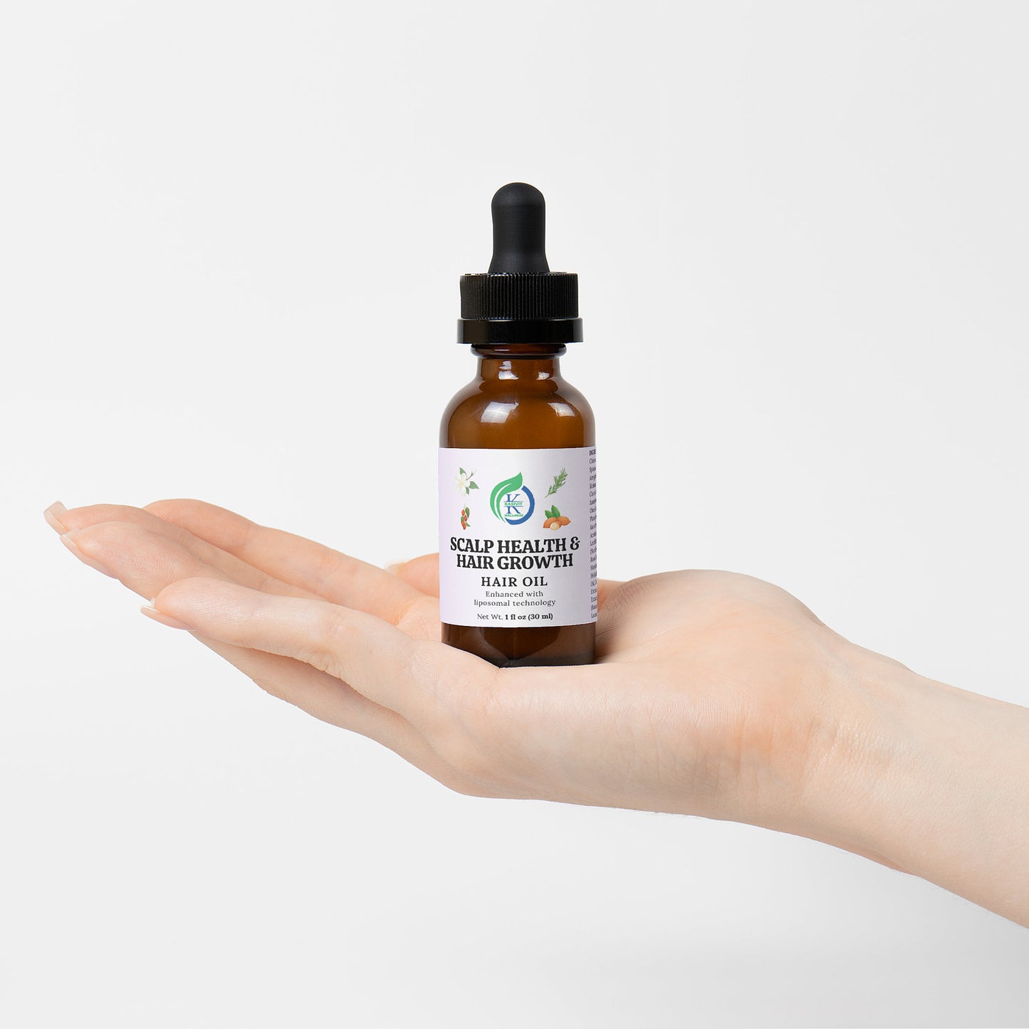 Kasivit Scalp Health Hair Growth Supplement Oil in a dropper bottle held in a hand