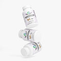 Kasivit Ashwagandha capsules in white bottles stacked with herbal design